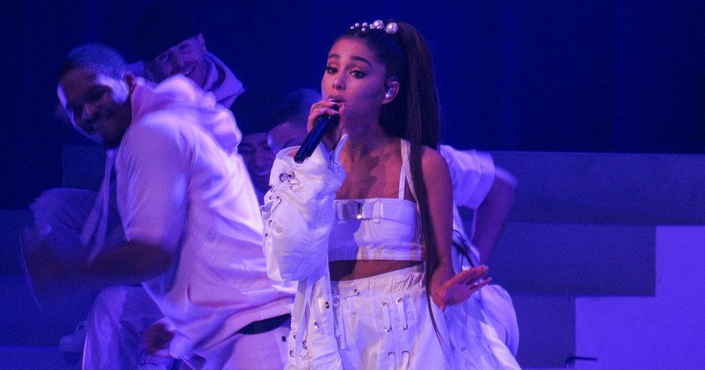Ariana Grande performing live on a concert.