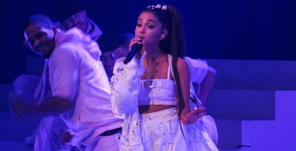 Ariana Grande performing at a live concert.