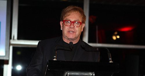 Elton John at a press conference.