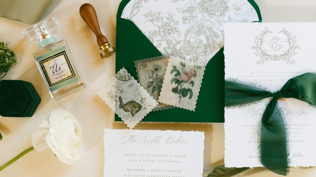 A table topped with wedding invitations.