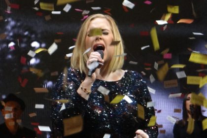 Adele performing at a live concert.