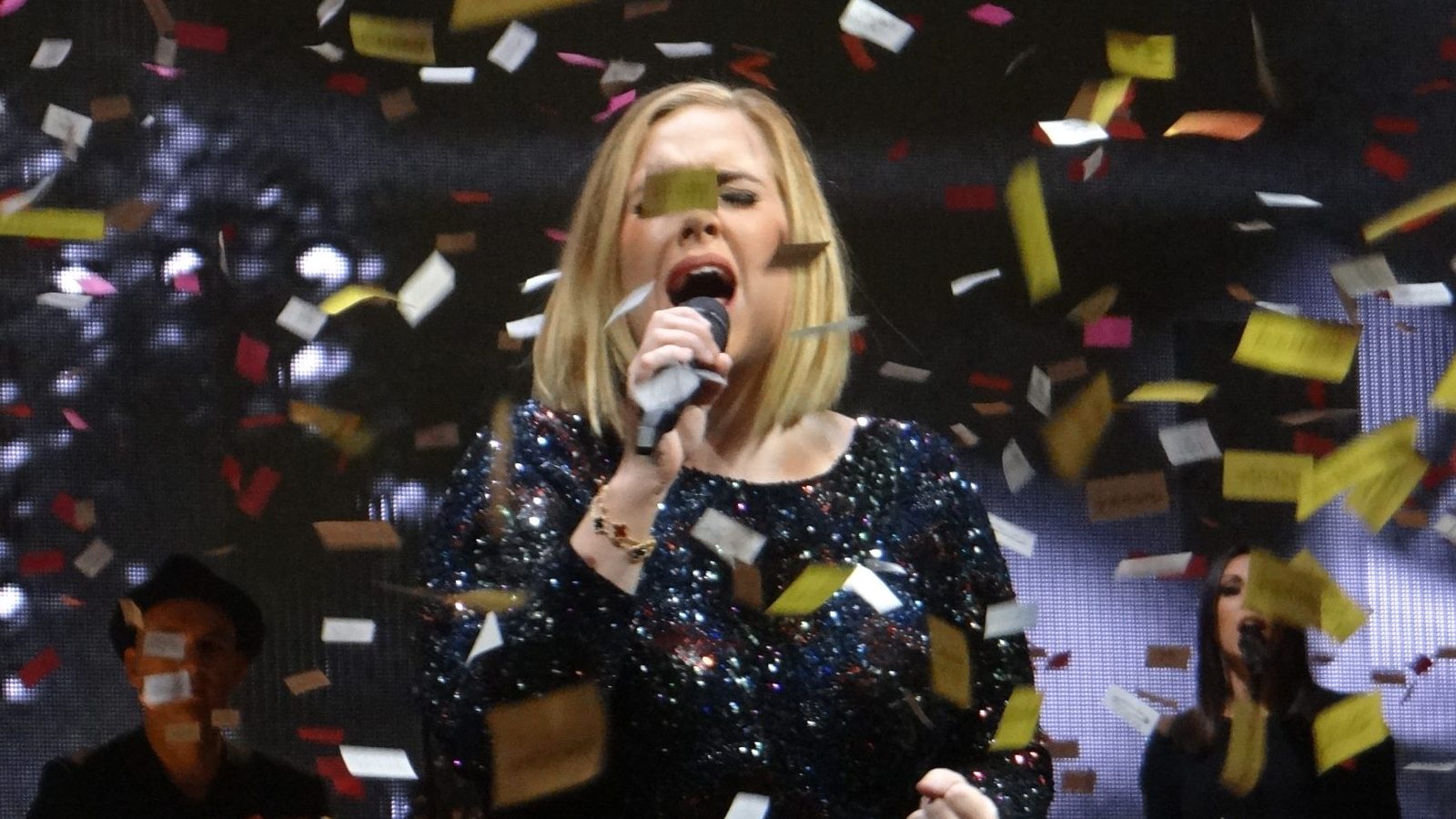 Adele performing at a live concert.