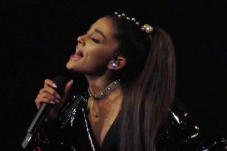 Ariana Grande performing at the concert.