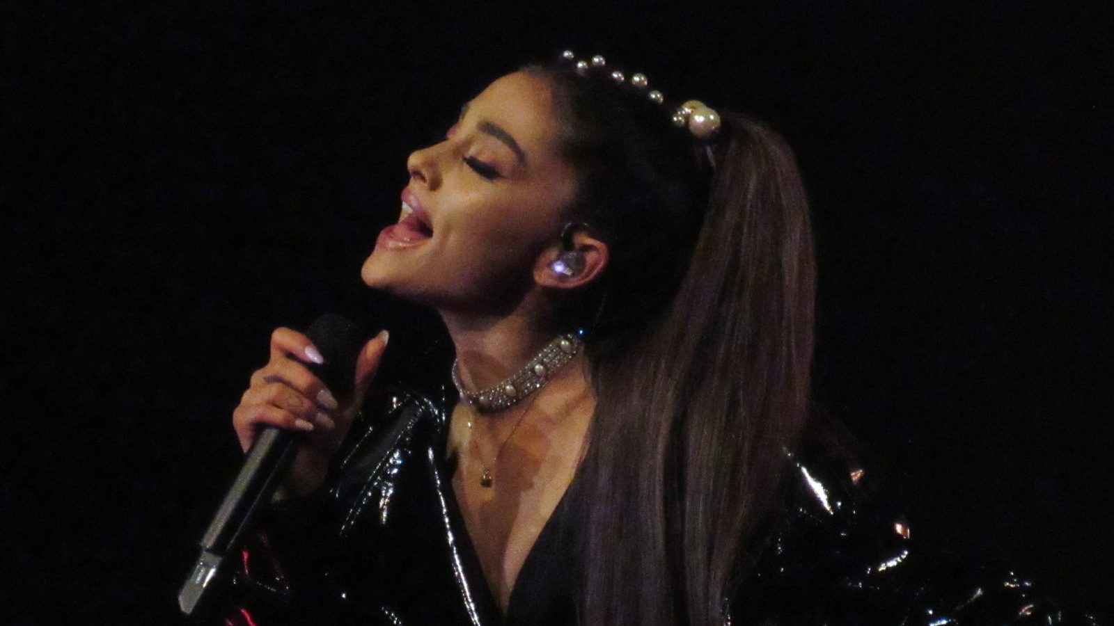 Ariana Grande performing at the concert.