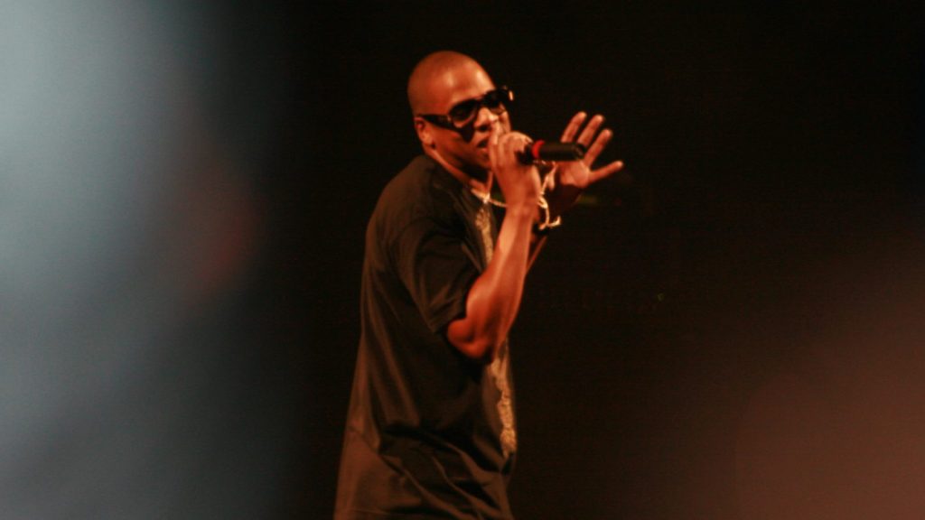 Jay-Z performing at a live concert.