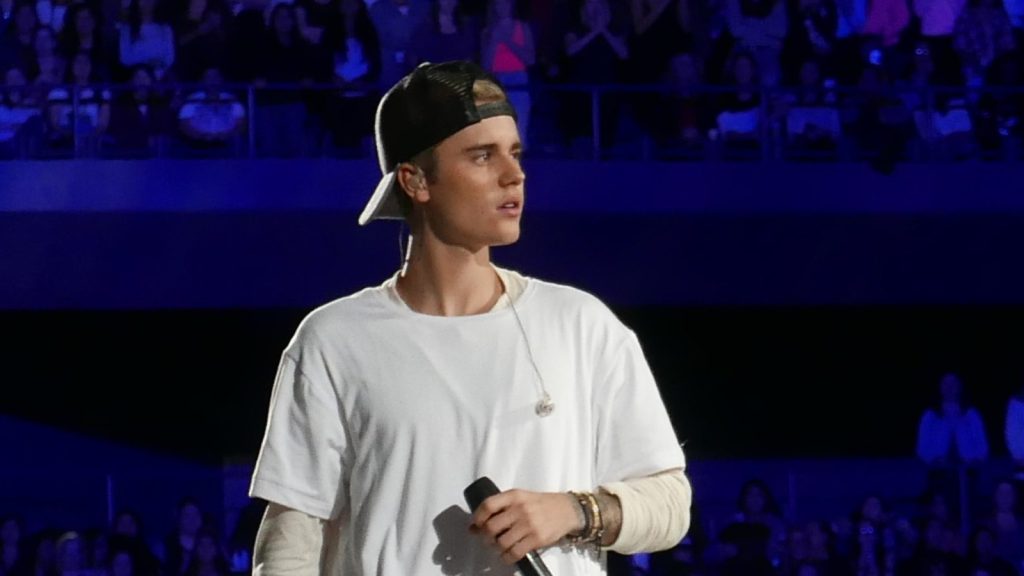 Justin Bieber performing at the live concert.