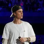Justin Bieber performing at the live concert.