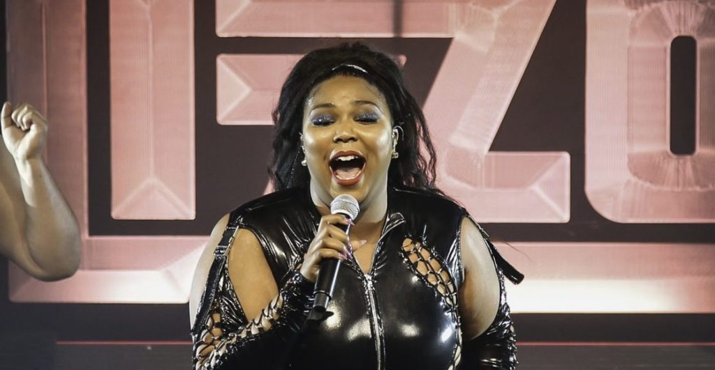 Lizzo performing at a live concert.