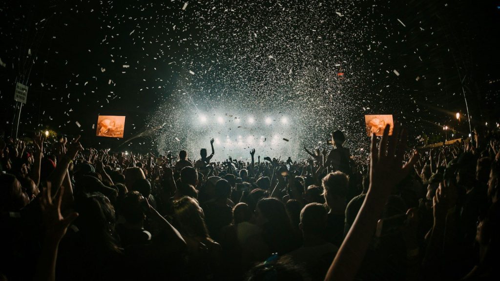 Crowd cheering at night.