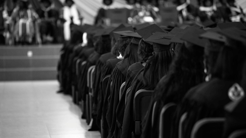 A group of people in graduation gowns.