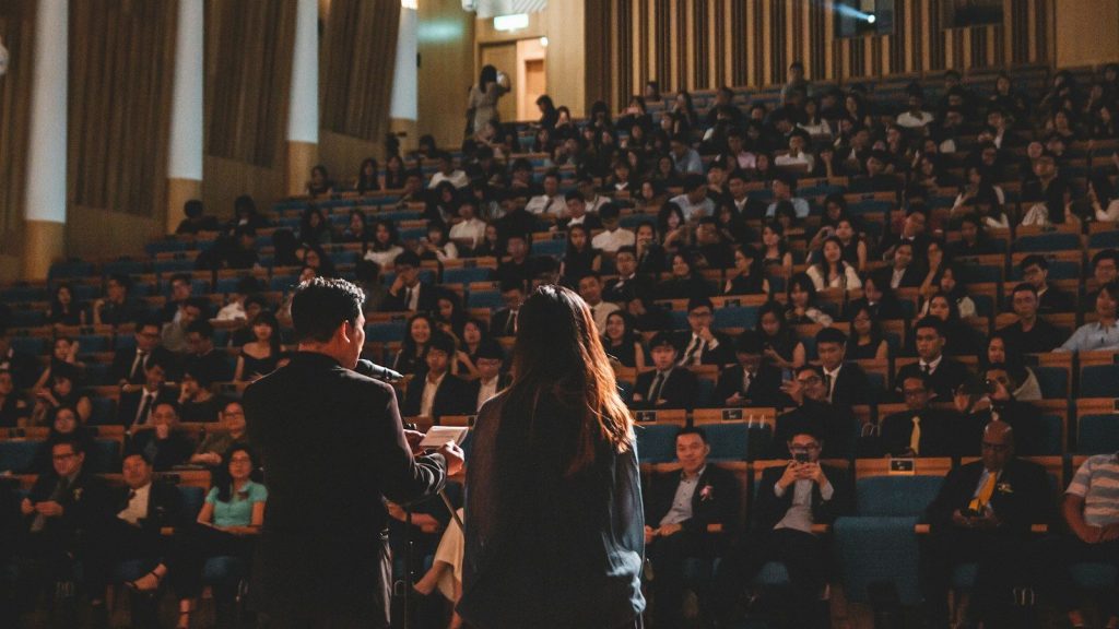 People sitting during award ceremony.
