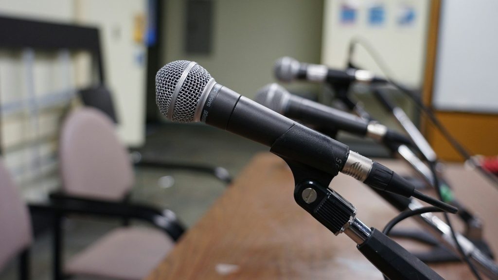 Microphones on a stand.