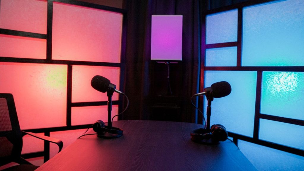 Two microphones were kept on a table in a podcast room.