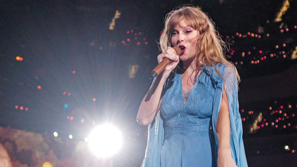 Taylor Swift performing at the concert.