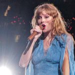 Taylor Swift performing at the concert.