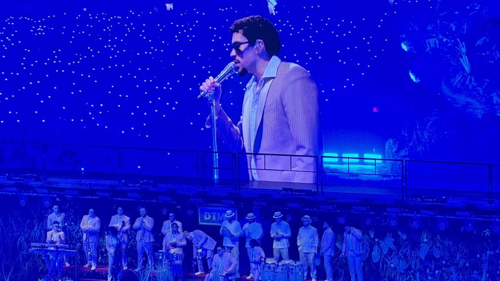 Bad Bunny performing live at an event.