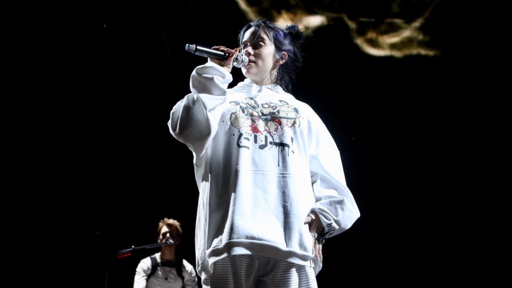 Billie Eilish performing at the live concert.