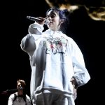 Billie Eilish performing at the live concert.