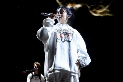 Billie Eilish performing at the live concert.