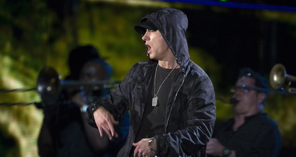 Eminem performing at a live concert.