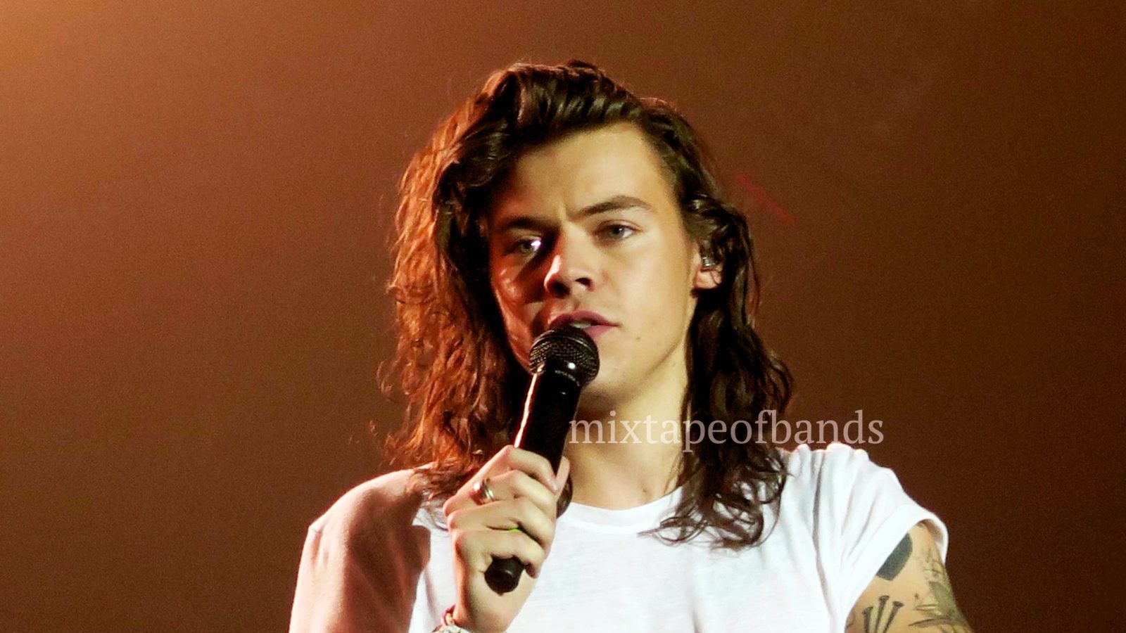 Harry Styles performing at the