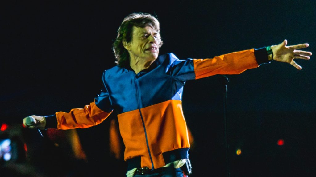 Mick Jagger performing at a live concert.