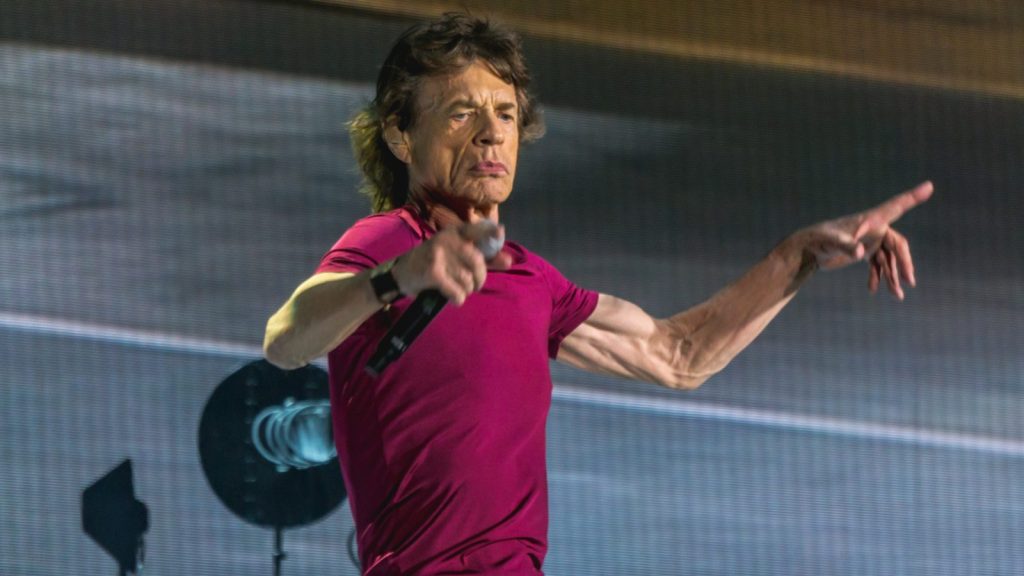 Mick Jagger performing at a live concert.