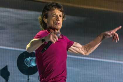 Mick Jagger performing at a live concert.