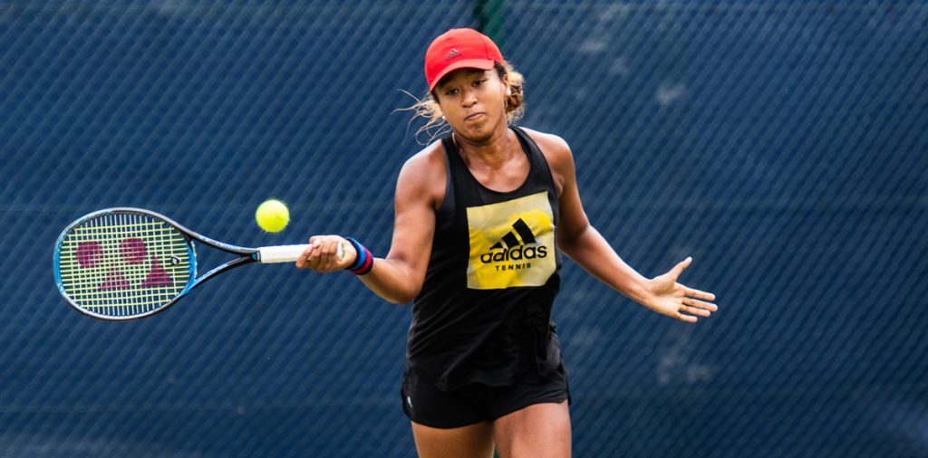 Naomi Osaka playing badminton.