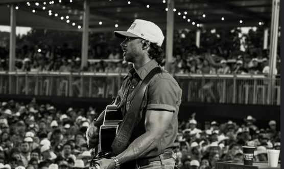 Riley Green performing at a live concert.