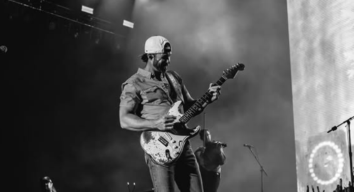Riley Green performing at a live concert.