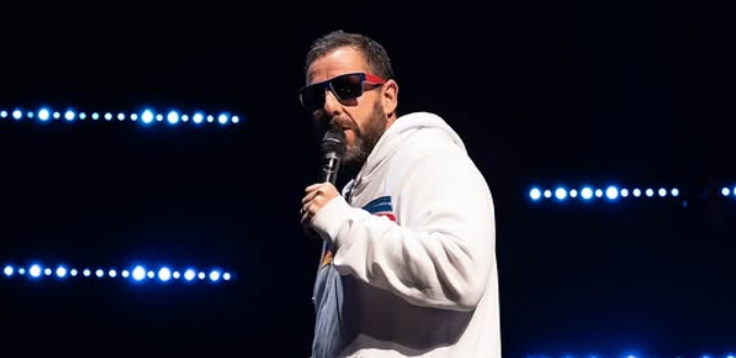 Adam Sandler performing live.