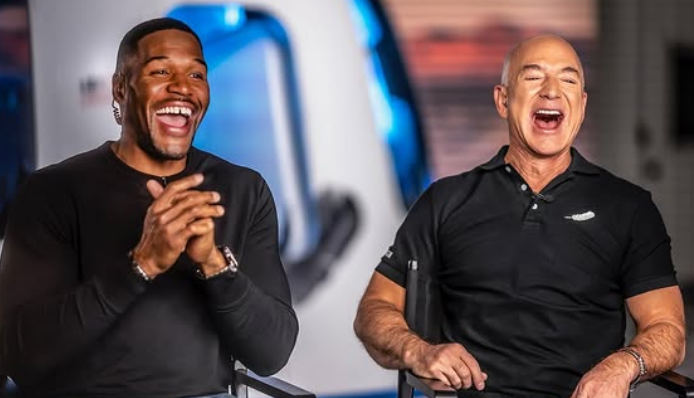 Jeff Bezos with Michael Strahan at the press conference.