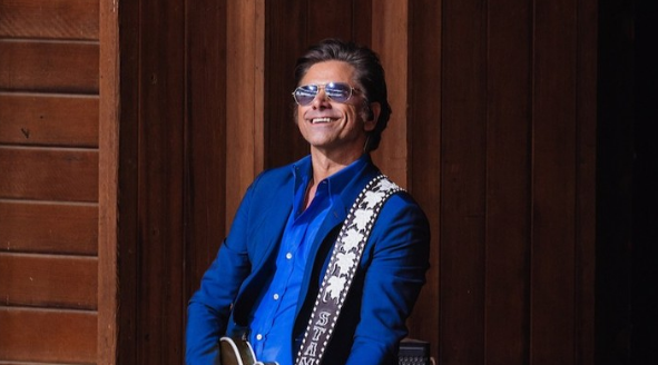 John Stamos performing live.
