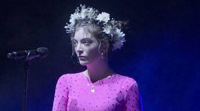 Lorde performing live.