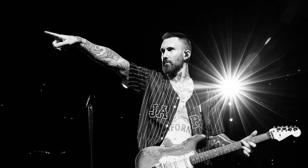 Adam Levine performing live.