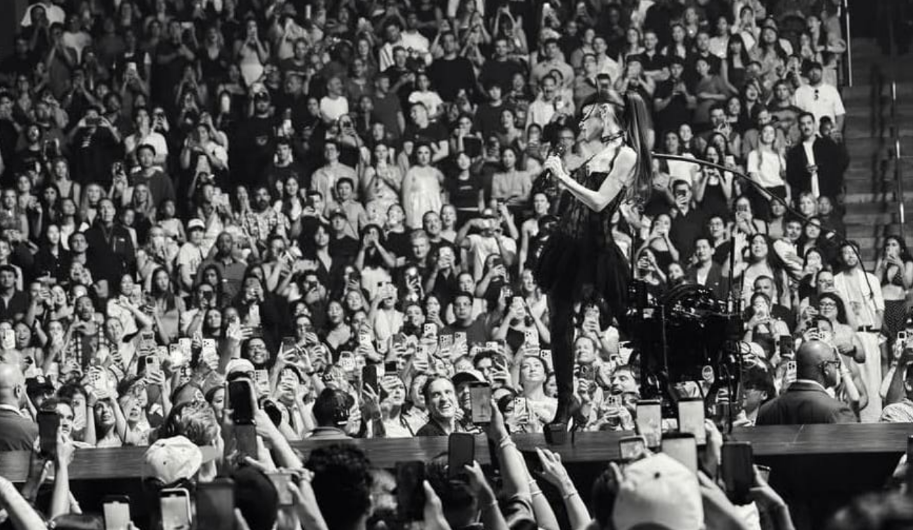 Ariana Grande performing at the concert.