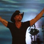 Tim McGraw performing at the live concert.