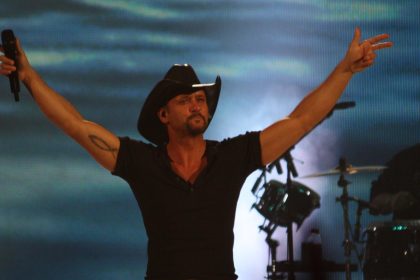 Tim McGraw performing at the live concert.