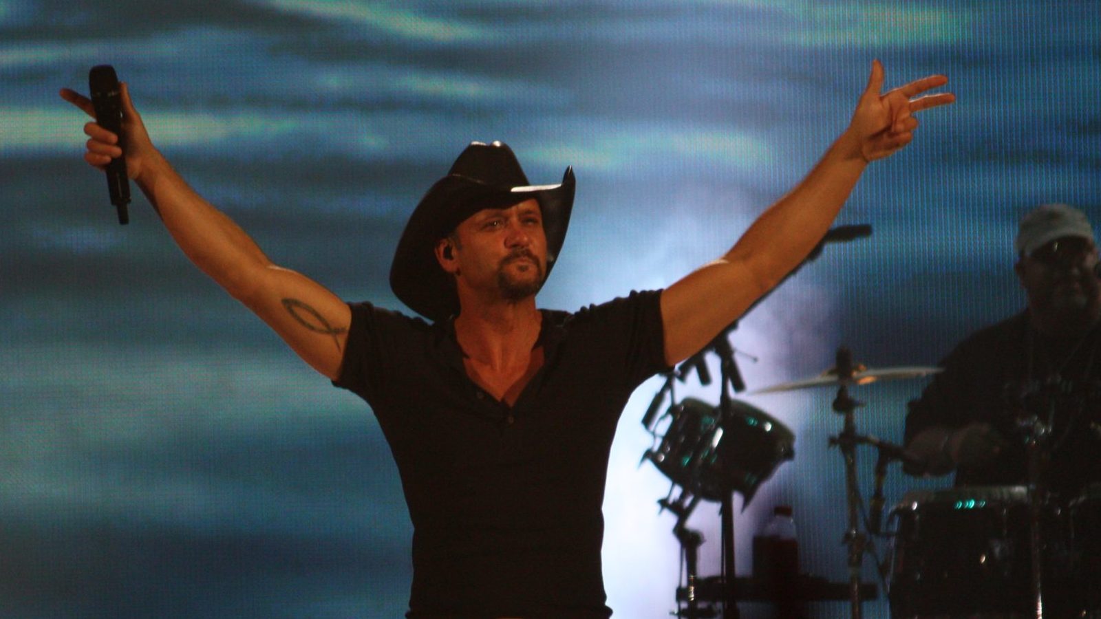 Tim McGraw performing at the live concert.