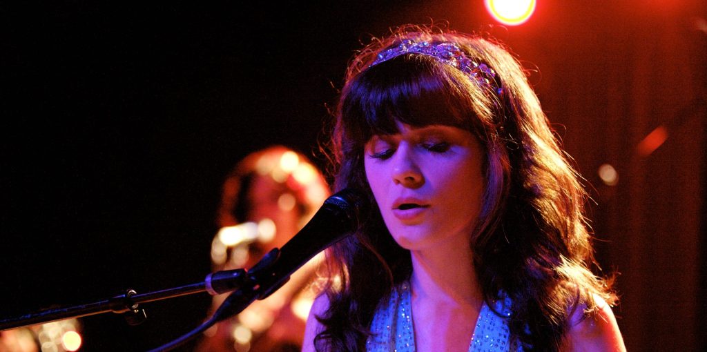 Zooey Deschanel performing live.