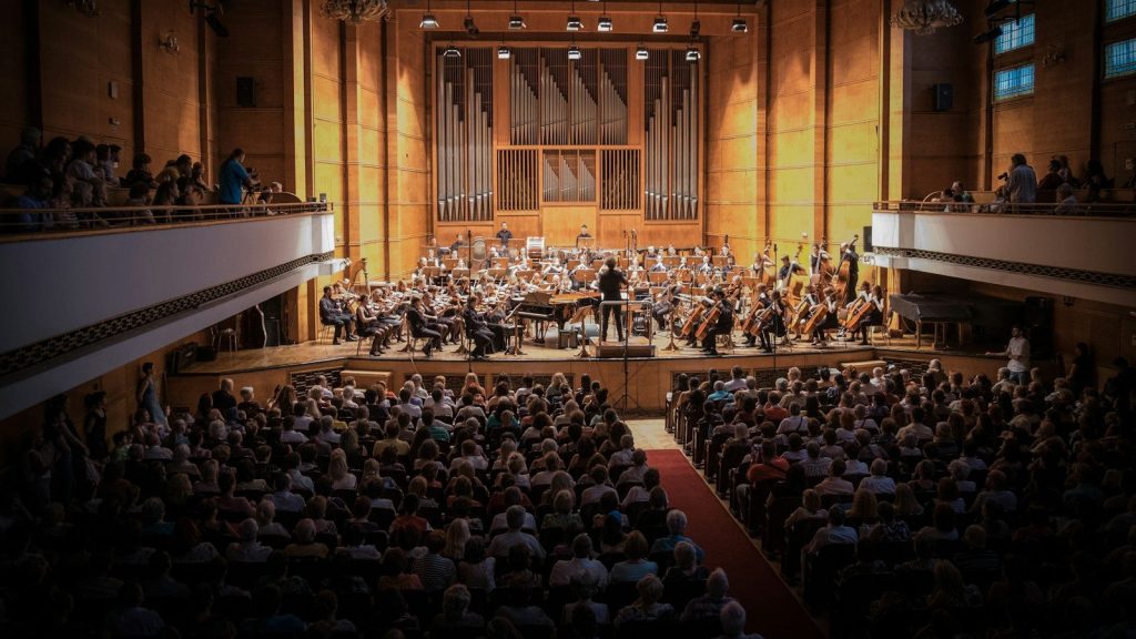 People watching the orchestra.