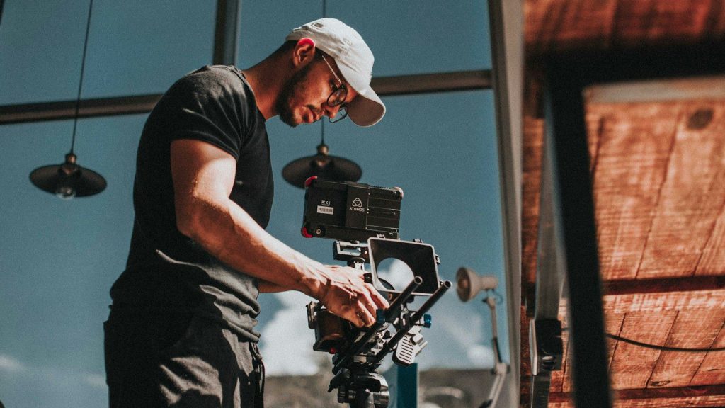 Man holding a film camera.