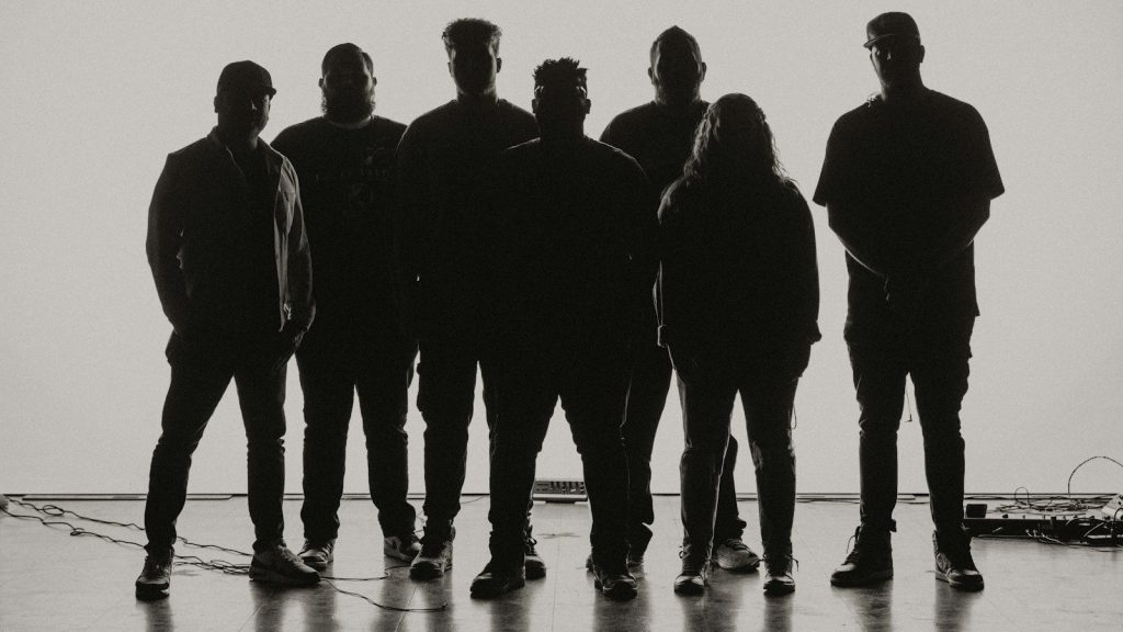a group of people standing next to each other