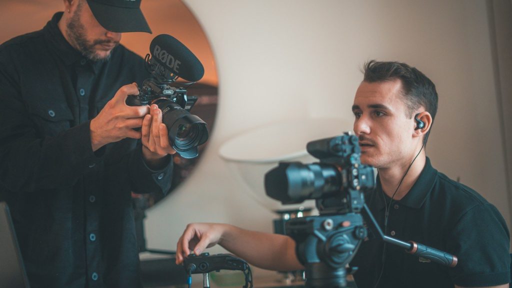 Camera crew recording a professional television interview.