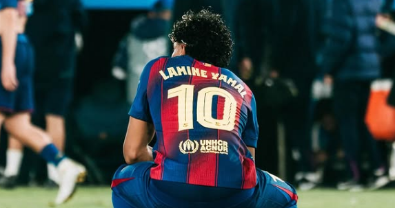Back view of Lamine Yamal wearing Barcelona's iconic number 10 jersey.