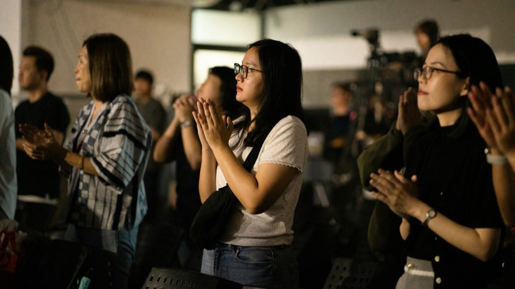 Audience applauding during a live television event.