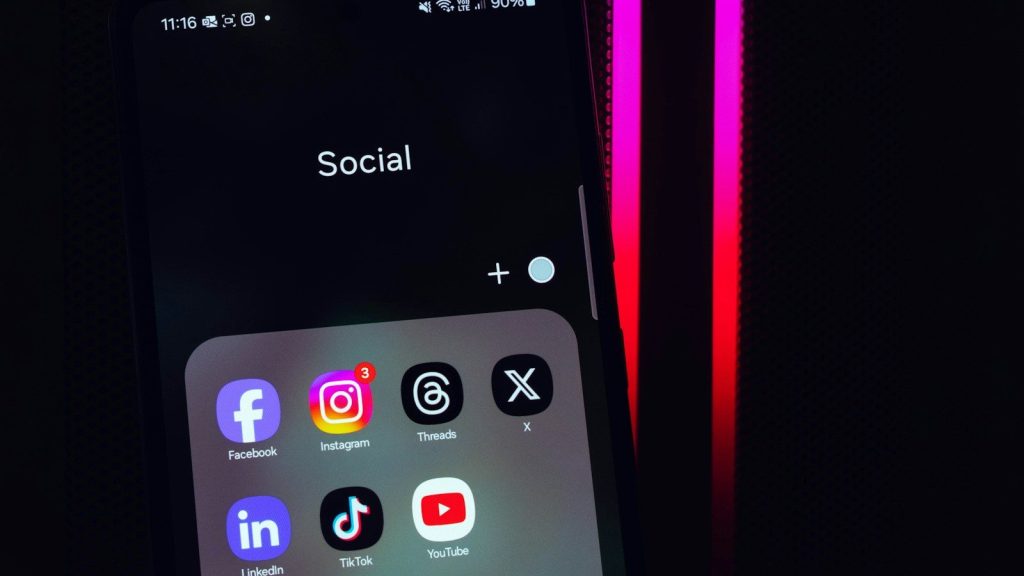 Smartphone displaying social media apps used for sharing viral content online.