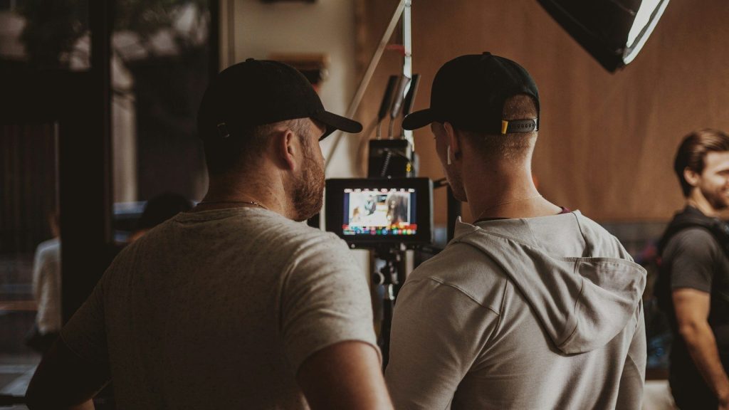 Film crew reviewing footage on set.
