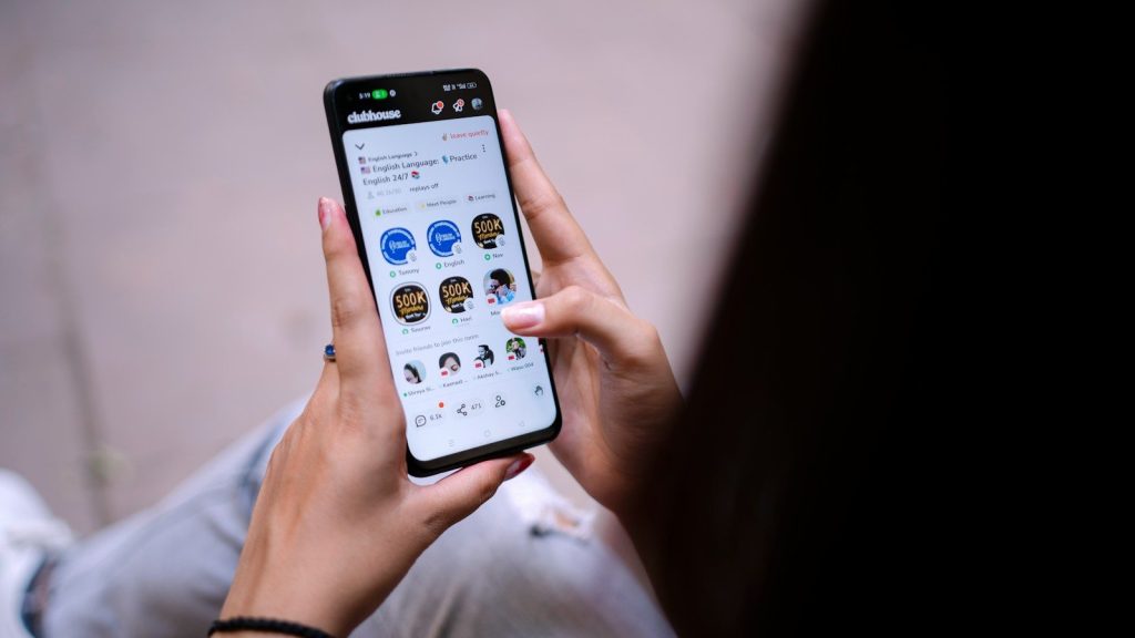 Person browsing social media on smartphone.